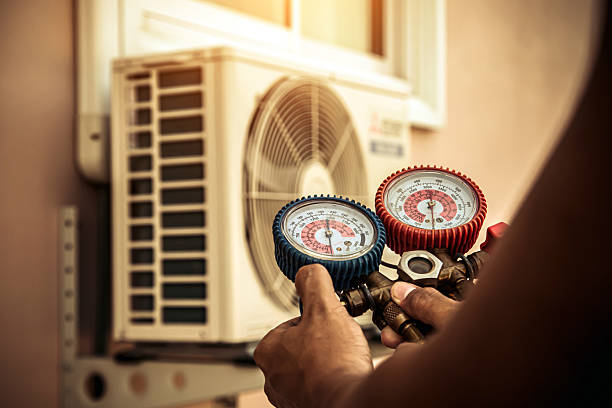 Professional Air Conditioning Service technician working in Graff, MO